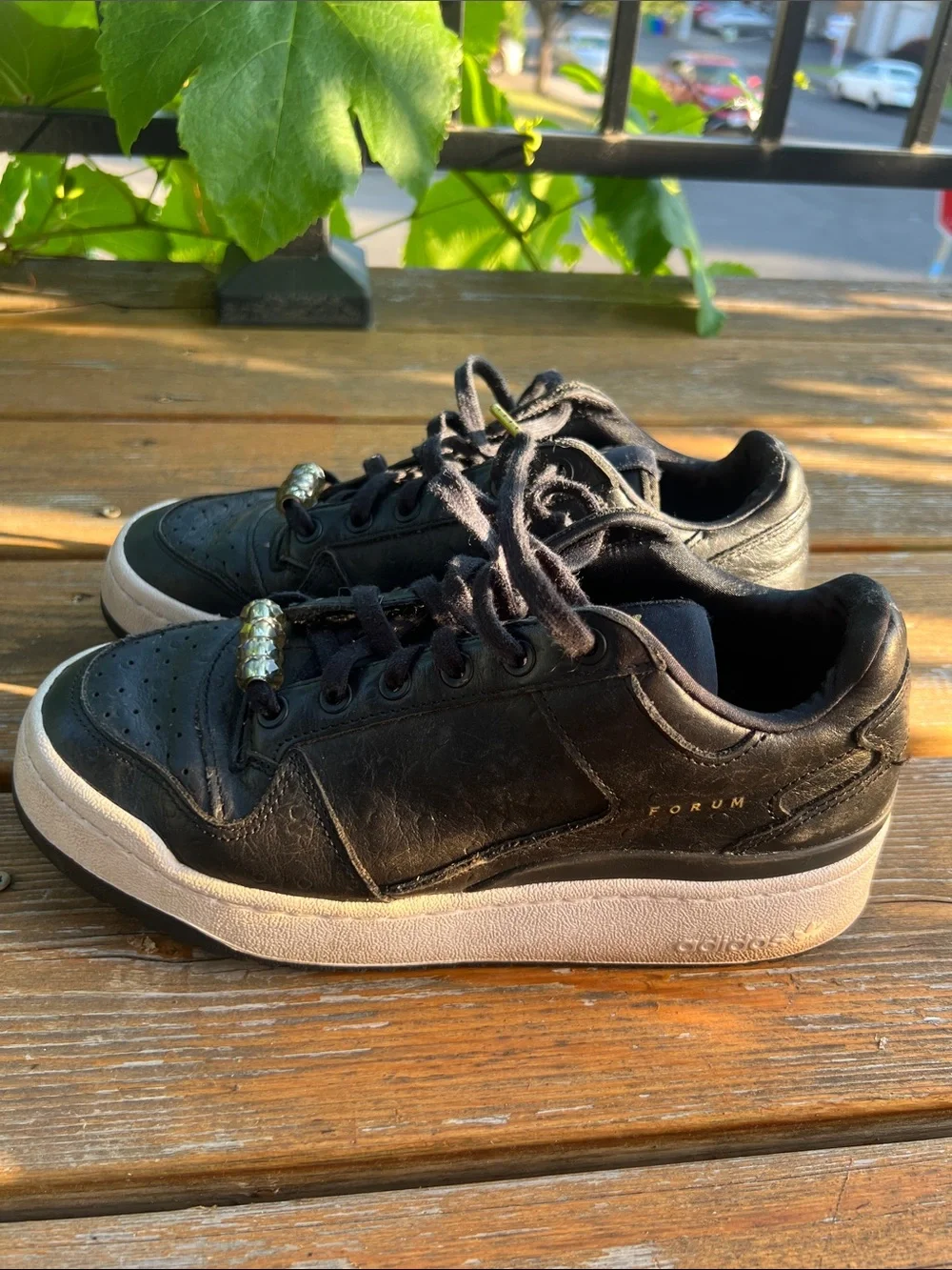 adidas Forum Black Leather Low-Top Sneakers with Gold Accents